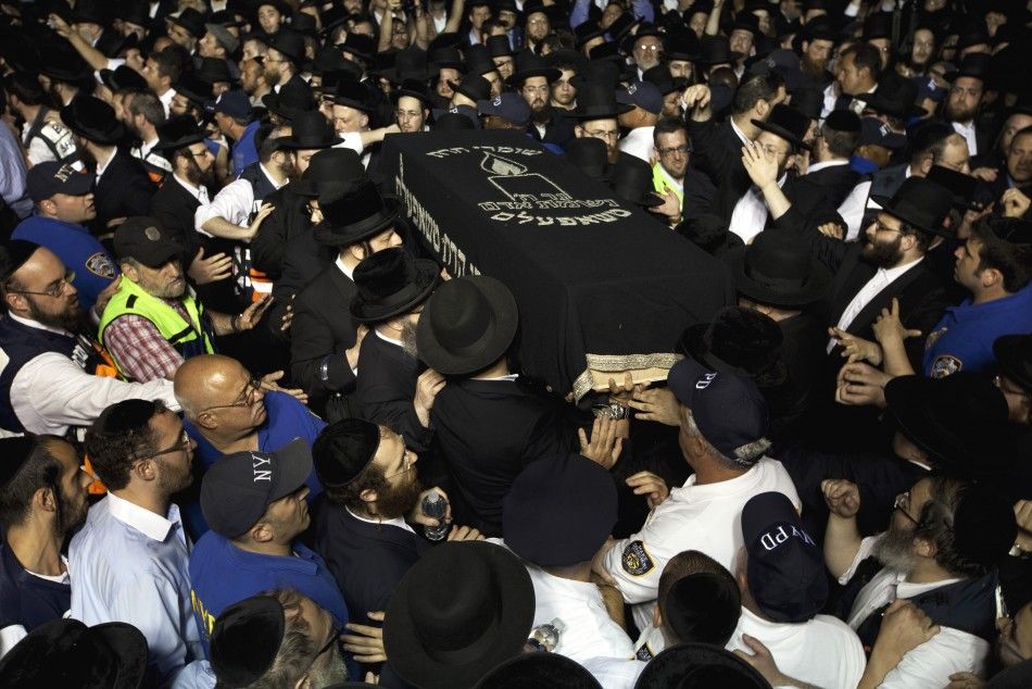 The casket of Leibby Kletzky is carried out of a synagogue after his funeral service in New York