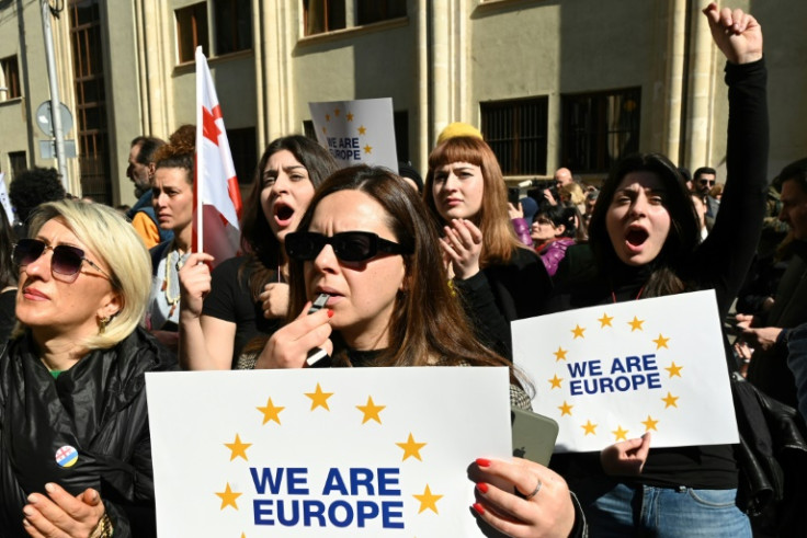 Georgian protesters rally outside the parliament as lawmakers vote to call off controversial "foreign agent" laws