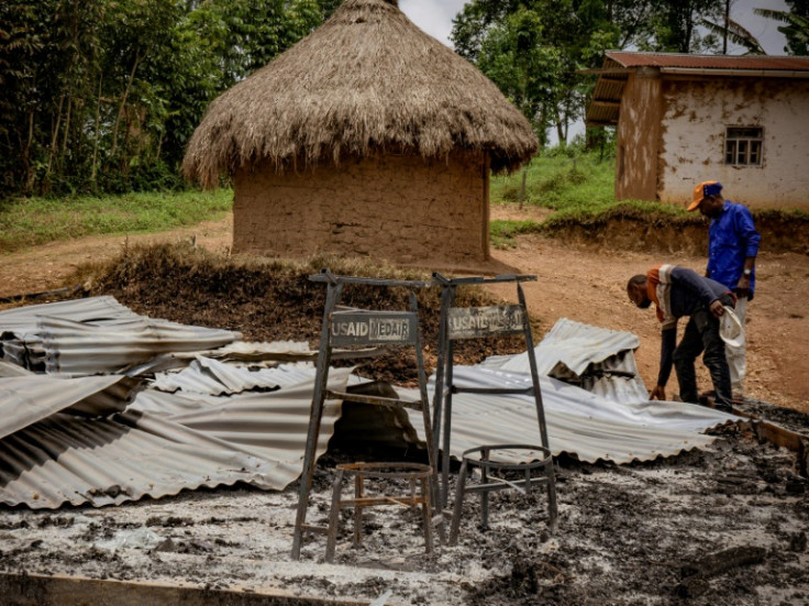 People visit Mukondi health centre, which was damaged during the attack which saw dozens of houses torched