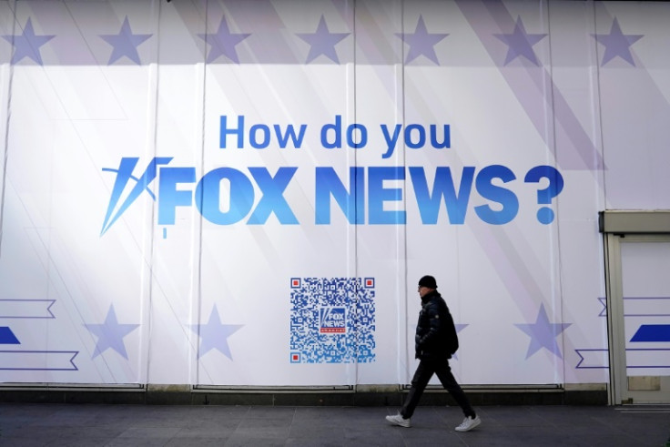 A pedestrian walks past a Fox News promo on March 9, 2023 in New York City