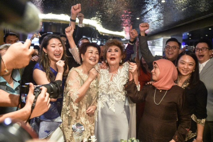 "I'm very happy... I'm proud of my daughter," said Janet Yeoh (centre) in Kuala Lumpur
