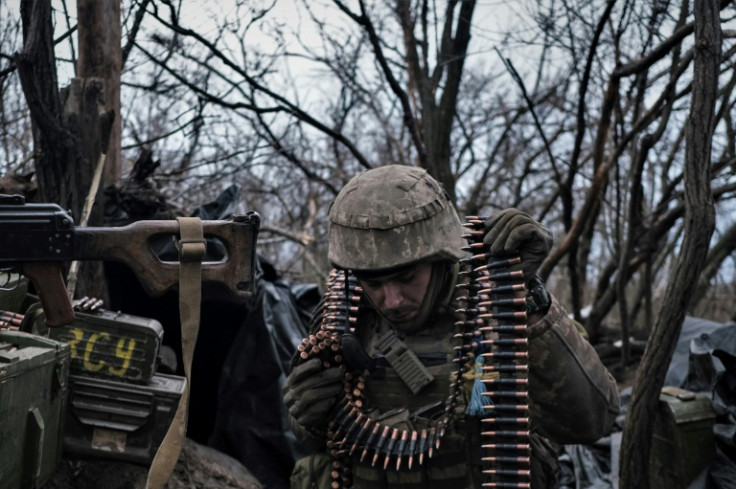 A soldier of the Ukrainian Volunteer Army prepares ammunition to fire at Russian frontline positions near Bakhmut