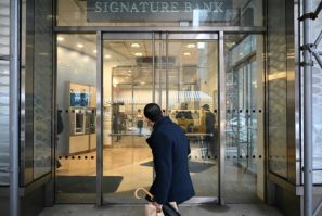 A man walks past a branch of Signature Bank in New York city on March 13, 2023