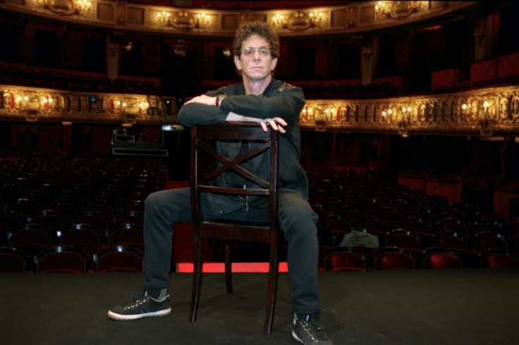 In this file photo taken on July 7, 1997, rocker Lou Reed poses on the stage of the Odeon Theatre in Paris, just before reading his poems in the show, "The music of city and time"