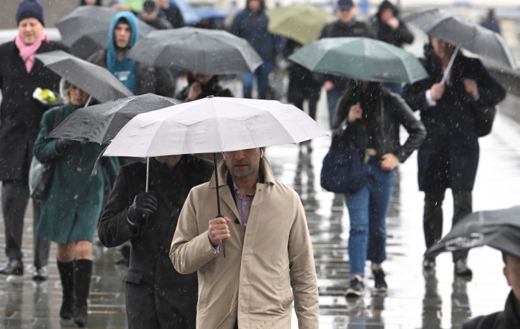 Workers cross London Bridge in London