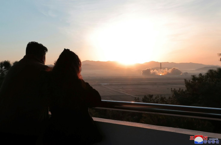 North Korean leader Kim Jong Un (L), accompanied by his daughter, personally oversaw the recent test-firing of the country's most powerful intercontinental ballistic missile