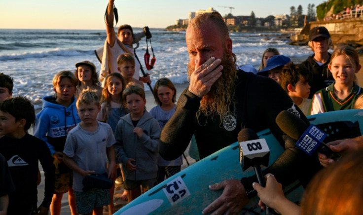 Blake Johnston shredded the world record for the longest surfing session, dodging swarms of jellyfish to ride hundreds of waves across 40 punishing hours