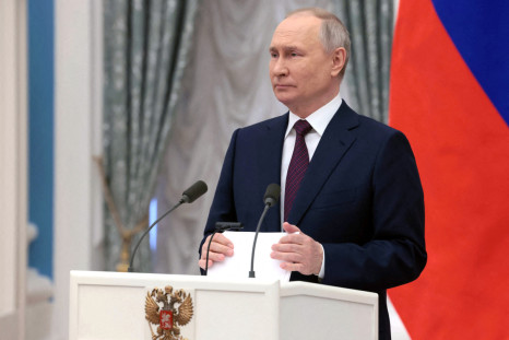 Russian President Putin attends a ceremony marking International Women's Day