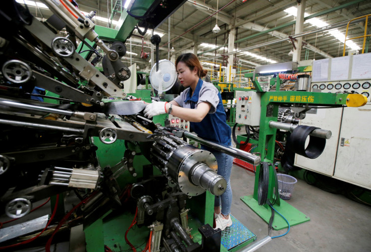 An employee works on the production line of a tyre factory under Tianjin Wanda Tyre Group in Xingtai