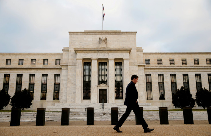 A man walks past the Federal Reserve Bank in Washington DC