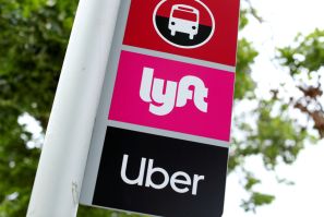 The logos of Lyft and Uber are displayed in San Diego