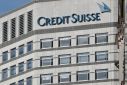 The Credit Suisse logo is seen at their offices at Canary Wharf financial district in London