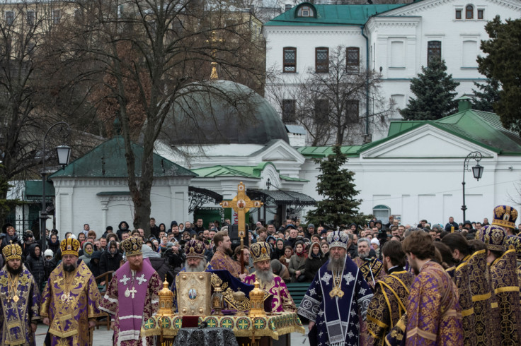 Believers attend a service lead by Metropolitan Onufriy, head of the Ukrainian Orthodox Church branch loyal to Moscow, at a compound of the Kyiv Pechersk Lavra monastery in Kyiv