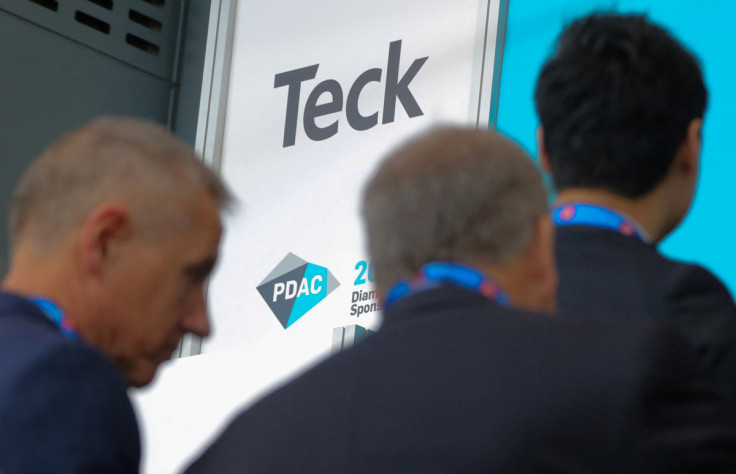 Visitors pass a logo of Teck Resources Ltd mining company during the PDAC convention in Toronto