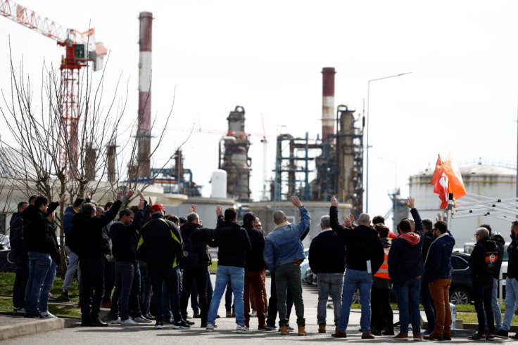 Workers on strike gather in front of the oil giant TotalEnergies refinery in Donges