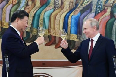 The talks were heavy on pomp and ceremony as Putin and Xi hailed a 'new era' in the relationship between their countries
