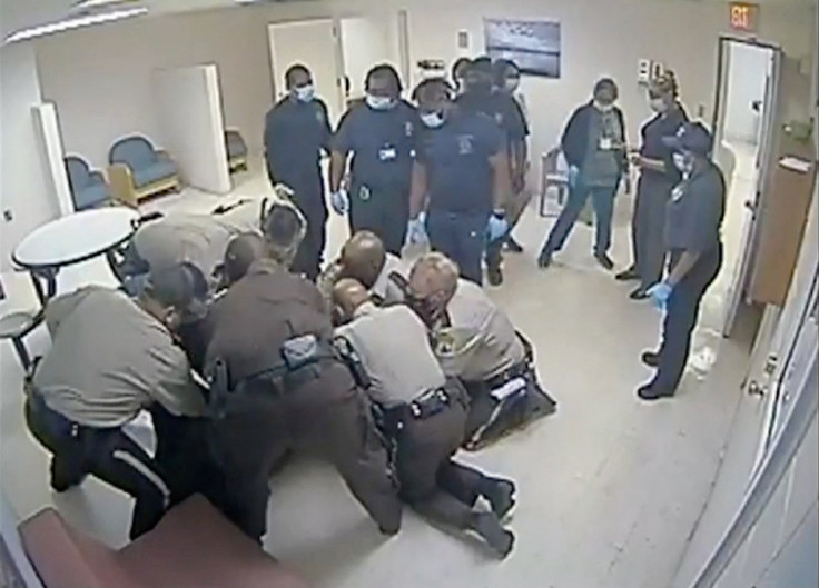 Virginia sheriff deputies wrestle with Irvo Otieno at a state mental hospital in Petersburg