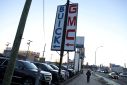 Signs advertising Buick and GMC, brands owned by General Motors Company, are seen at a car dealership in Queens, New York