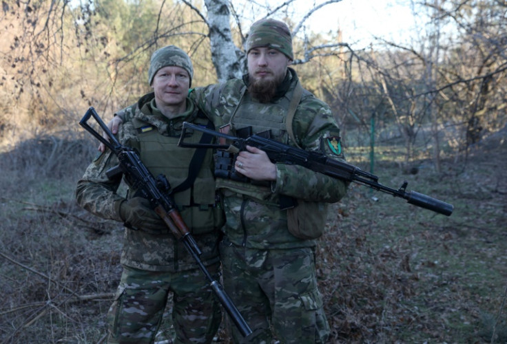 Volodymyr Chaikovsky, left, and his son, also Volodymyr, near the front lines in eastern Ukraine