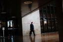 A man walks in front the Central Bank headquarters building in Brasilia