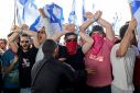 Demonstrators, carrying Israeli flags, rallies against the reforms that would give politicians more power over the courts