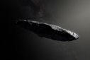 Handout photo of an artist's impression of the first interstellar asteroid `Oumuamua as it passes through the solar system after its discovery