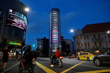 The Ten Square car vending machine lights up at dusk in Singapore