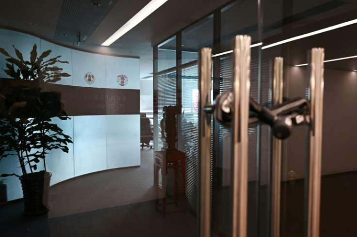 The closed office of the Mintz Group is seen in an office building in Beijing on March 24, 2023