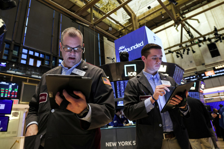 Traders work on the floor of the NYSE in New York