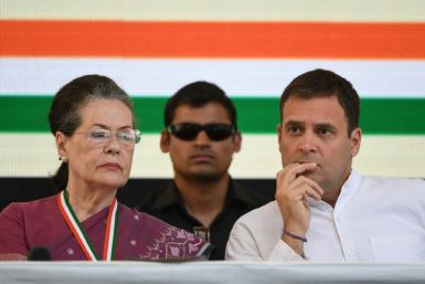 Rahul Gandhi (R) and his mother, the Indian National Congress party's former president, Sonia Gandhi (L), attend an event in New Delhi in 2019