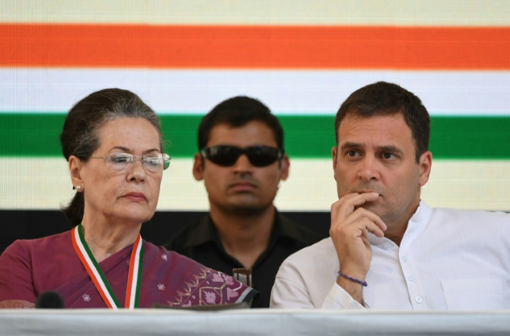 Rahul Gandhi (R) and his mother, the Indian National Congress party's former president, Sonia Gandhi (L), attend an event in New Delhi in 2019