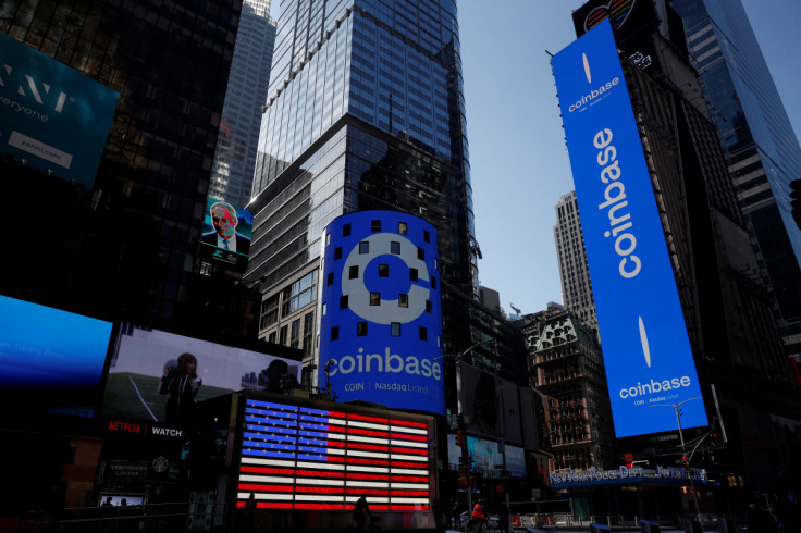 The logo for Coinbase Global Inc is displayed on the Nasdaq MarketSite jumbotron and others at Times Square in New York