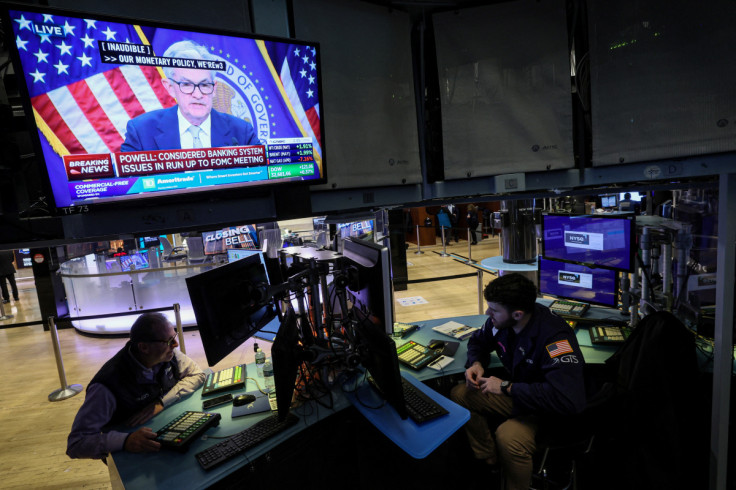 Traders react to Fed rate announcement on the floor of the NYSE in New York