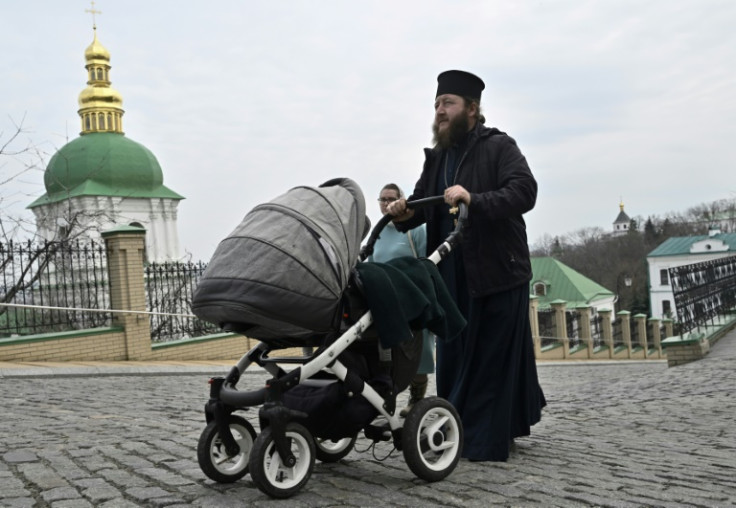 Monks say they plan to stay as long as possibleA priest pushes a baby carriage as he walks at Kyiv-Pechersk Lavra, also known as the Kyiv Monastery of the Caves, a historical Eastern Orthodox Christian monastery in Kyiv, on March 24, 2023.