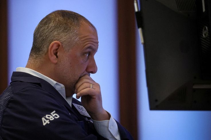 Traders work on the floor of the NYSE in New York