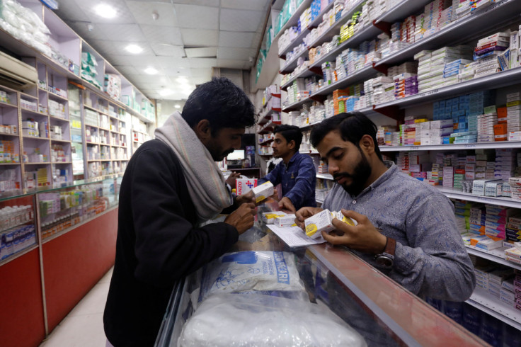 A customer buys medicine from a medical supply store in Karachi