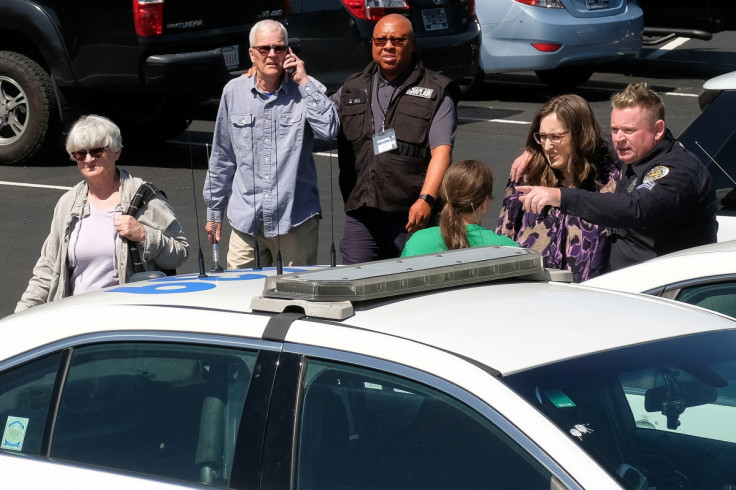 A police officer speaks with a woman at a family reunification center after a mass shooting in Nashville