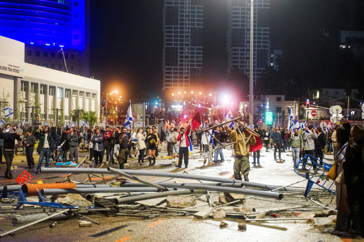 Debris blocks the street during a demonstration against Israeli Prime Minister Benjamin Netanyahu and his nationalist coalition government's plan for judicial overhaul, in Tel Aviv