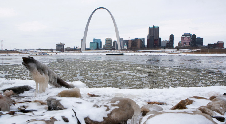 The Gateway Arch is seen across from snow covered banks of the Mississippi River during cold weather in St Louis