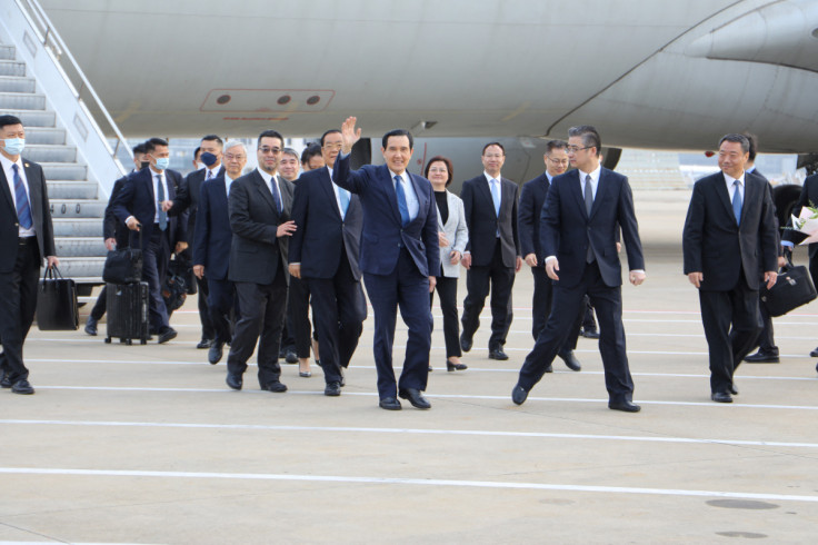 Former Taiwanese President Ma Ying-jeou gestures as he arrives at an airport in Shanghai