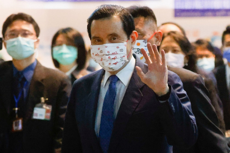 Former Taiwan President Ma Ying-jeou waves to the media at the airport before departing on a visit to China