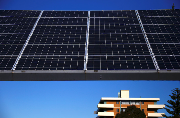 A solar array, a linked collection of solar panels, can be seen in front of a residential apartment block in the Sydney suburb of Chatswood in Australia