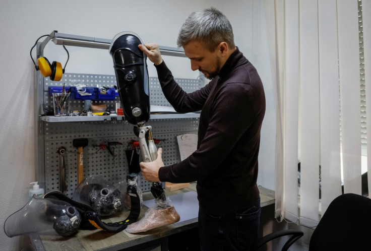 Andrii Ovcharenko, the head of the prosthetics clinic "Without limits" shows a prosthetics, made in the clinic in Kyiv