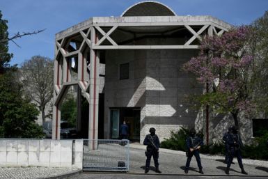 Portuguese police officers stand guard in front of the Ismaili Islamic centre in Lisbon