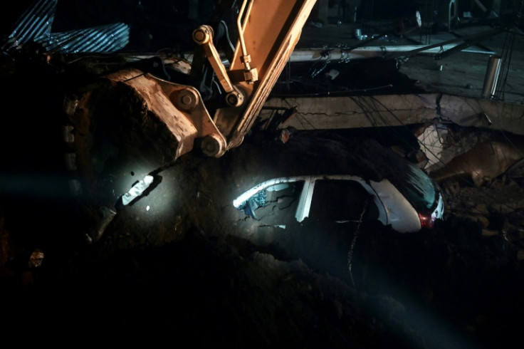 Teams of rescuers search for survivors after the landslide in suthern Ecuador