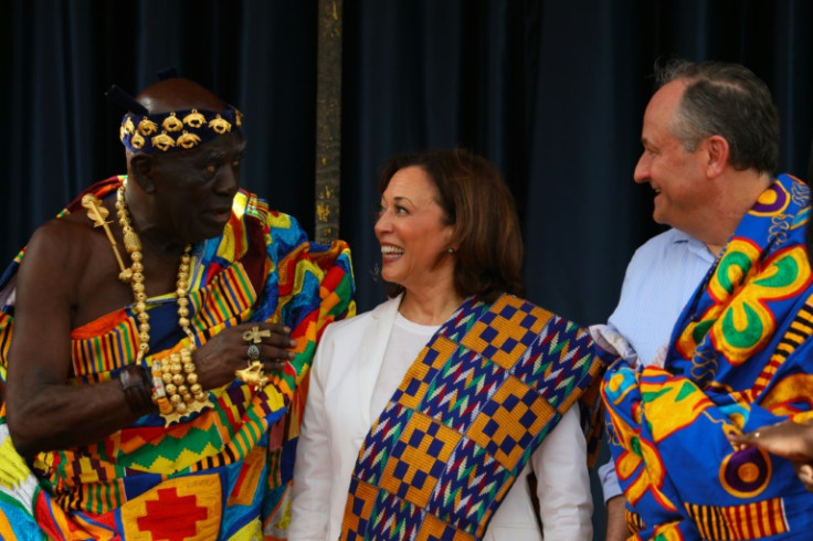 Harris and Second Gentleman Douglas Emhoff receive Kente cloths from Chief Osabarima Kwesi Atta II in Ghana