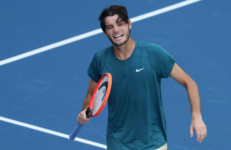 Taylor Fritz of the United States celebrates after his straight sets victory against Holger Rune of Denmark in their fourth round match at the Miami Open on Tuesday