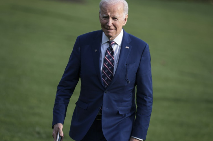 US President Joe Biden walks on the South Lawn of the White House ahead of a Summit for Democracy