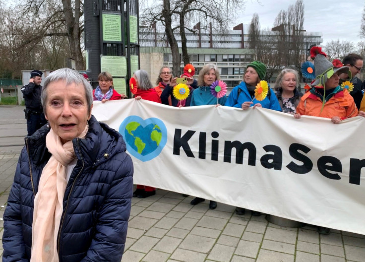 Anne Mahrer, co-president of the Senior Women for Climate Protection, stands in front of supporters outside the European Court of Human Rights in Strasbourg