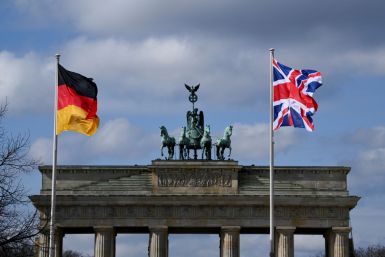 A German and a Union Jack flag fly at Brandenburg Gate, in Berlin